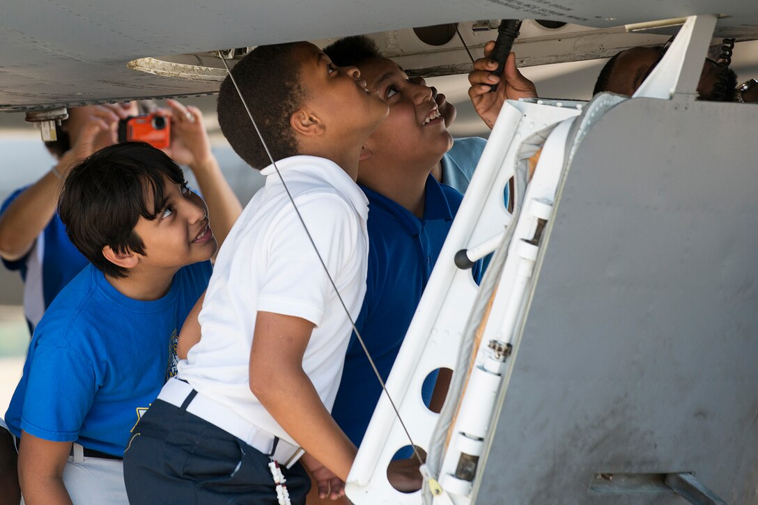 STARBASE students look up into the cockpit of a 93rd Bomb Squadron B-52H Stratofortress during a tour on Sept. 30, 2014, Barksdale Air Force Base, La. STARBASE Louisiana at Barksdale is one of 70 national STARBASE sites and is sponsored by the 307th Bomb Wing and the Air Force Reserve Command. (U.S. Air Force photo by Master Sgt. Greg Steele/Released)
