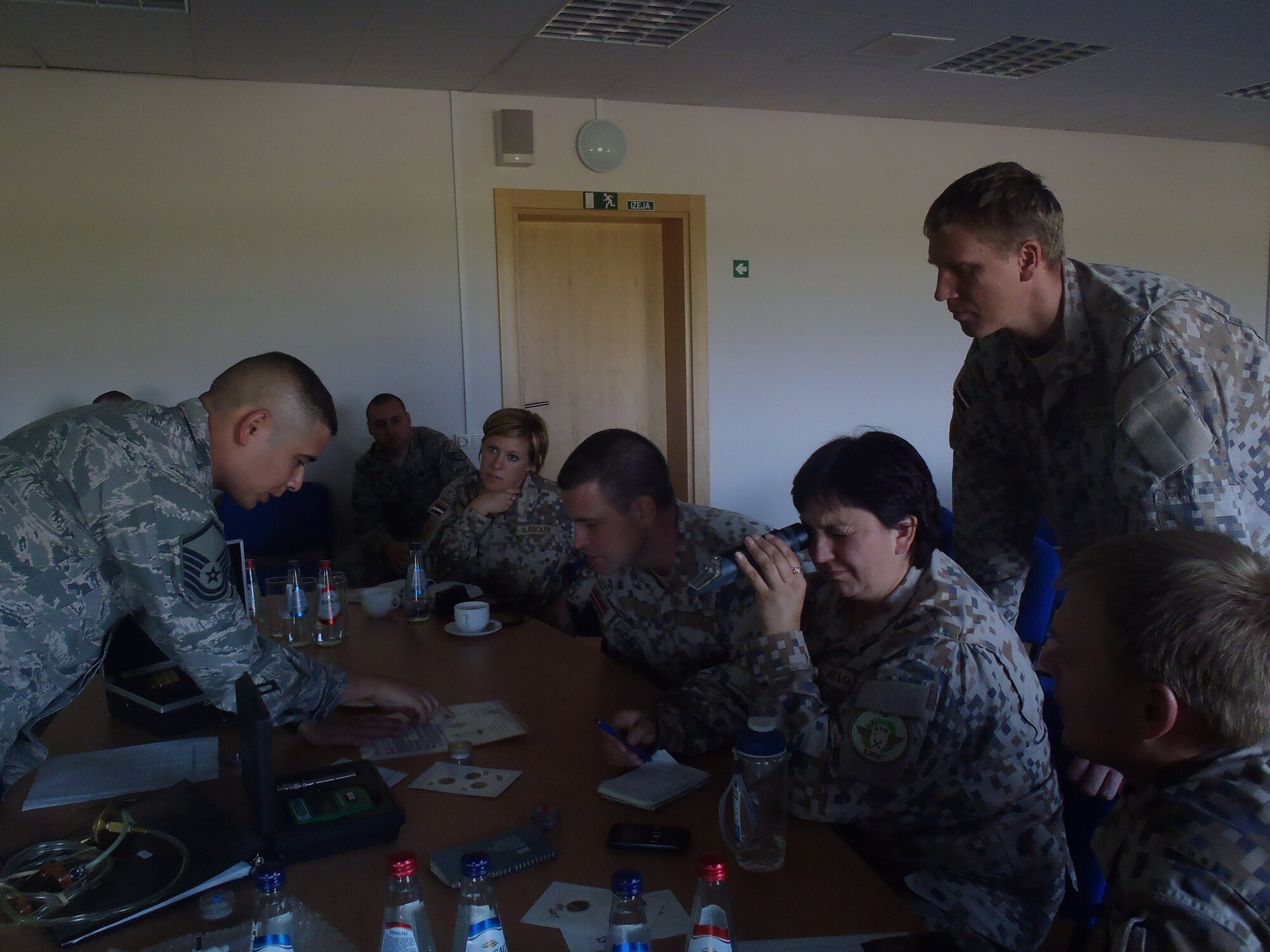 Master Sgt. Albert Black, 435th Contingency Response Group air advisor, instructs a Latvian fuels team on a fuels system icing inhibitor at Lielvarde Air Base, Latvia. The 435th Air Ground Operations Wing’s Air Advisor Branch executed five missions at once, the most it has ever done in one week, Sept. 15 to 19 in three NATO countries.
