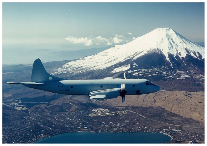 A P-3 Orion from Misawa Air Base, Japan flys past Mt. Fuji, date unknown. (U.S. Air Force photo)