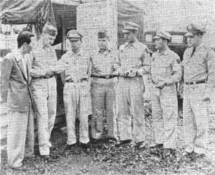 Mr. Y. Yokohama, Capt. N.F. Reed, Maj. J. Matsumoto, Sgt. Hurbert Dumas, Capt. Y. Kadoi, Capt. Z. Muta and 1st Lt. D.R. Fitzgeralddiscuss plans to handle the administration and training of Japan Air Self-Defense Force students who arrived at Misawa Air Base in October, 1954. (U.S. Air Force photo)