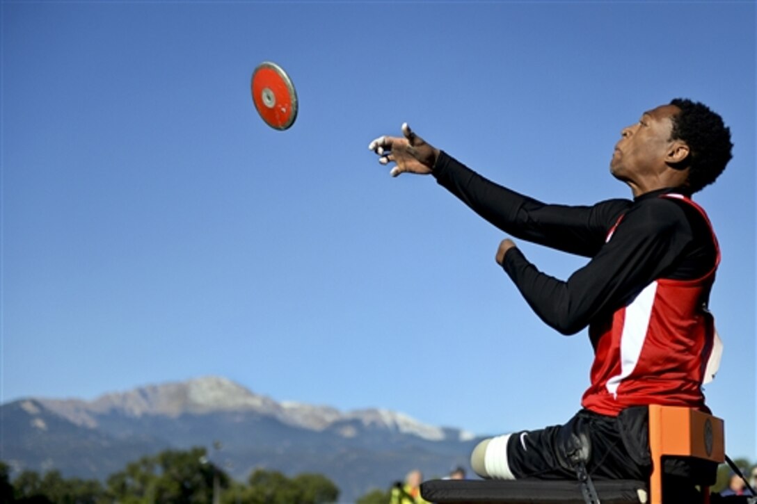 The Marine Corps team's Sgt. Anthony McDaniel Jr. throws the discus during the 2014 Warrior Games in Colorado Springs, Colo., Sept. 30, 2014. More than 200 wounded, ill and injured service members, and veterans are competing in the Warrior Games at the U.S. Olympic Training Center. 