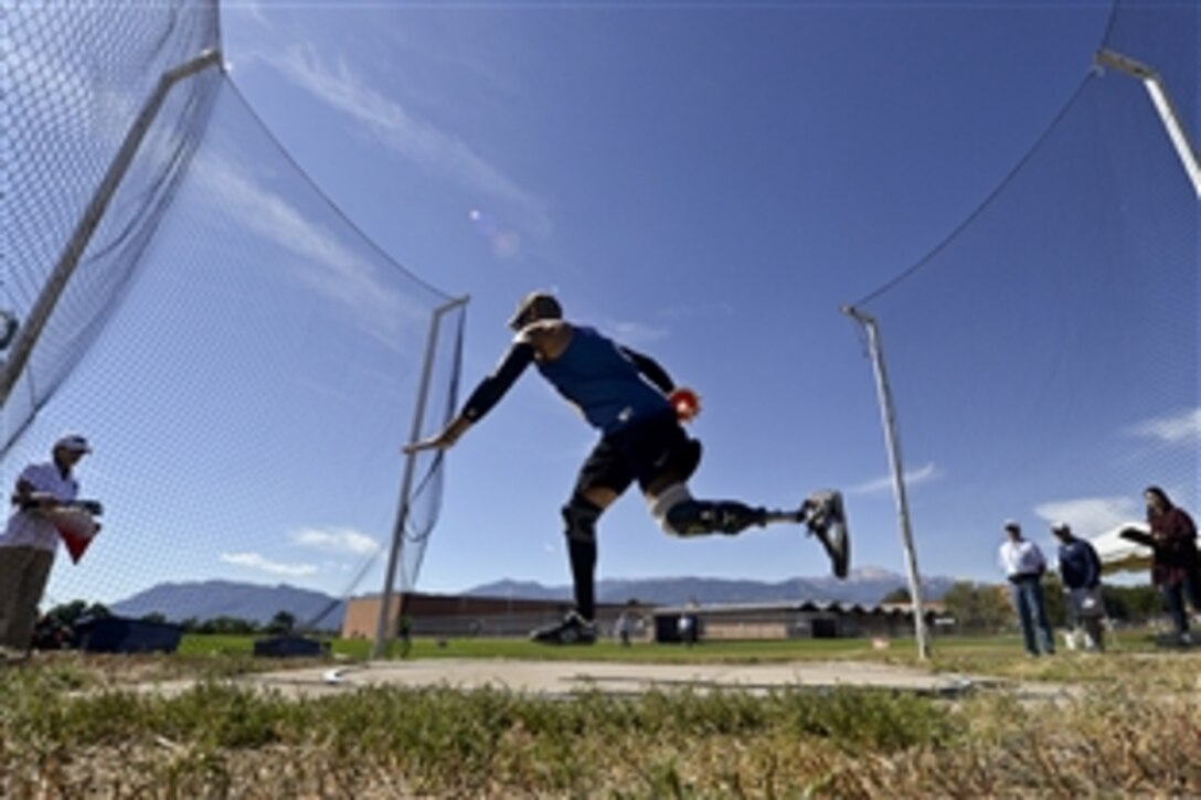 The Air Force team’s Master Sgt. Chris Aguilera throws the discus during the 2014 Warrior Games in Colorado Springs, Colo., Sept. 30, 2014. More than 200 wounded, ill and injured service members are competing in the Warrior Games at the U.S. Olympic Training Center.