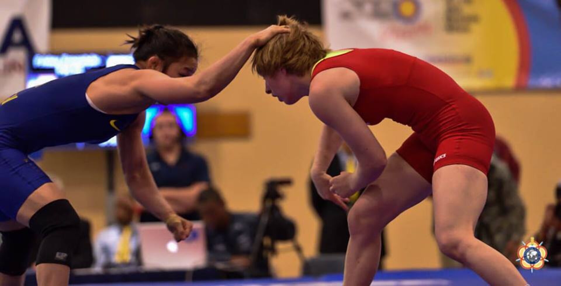 Army Sgt. Whitney Condor (red) against Hui Li of China during the 2014 CISM World Military Wrestling Championship at Joint Base McGuire-Dix-Lakehurst, New Jersey on 3 October 2014.