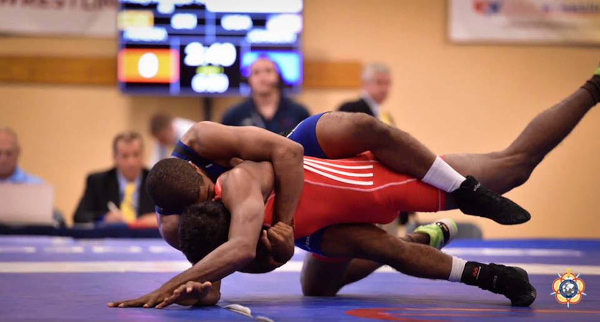 Army PFC Jamel Johnson (blue) turns his opponent during his victory over Chamara Perera (Sri Lanka), 16-5 in the Men's Freestyle 65kg division. Johnson place 5th in his division during the 2014 CISM World Military Wrestling Championship at Joint Base McGuire-Dix-Lakehurst, New Jersey on 3 October 2014.