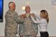 Captain Lee Nietzel is promoted to Major on Oct 3, 2014. Nietzel is being pinned on by Lt. Col. Daniel Tester and his wife as is now entering the ranks of field grade officer for the 174th 174th Operations Support Squadron located on Hancock Field in Syracuse, NY. (U.S. Air National Guard photo by Tech. Sgt. Justin A. Huett/Released)