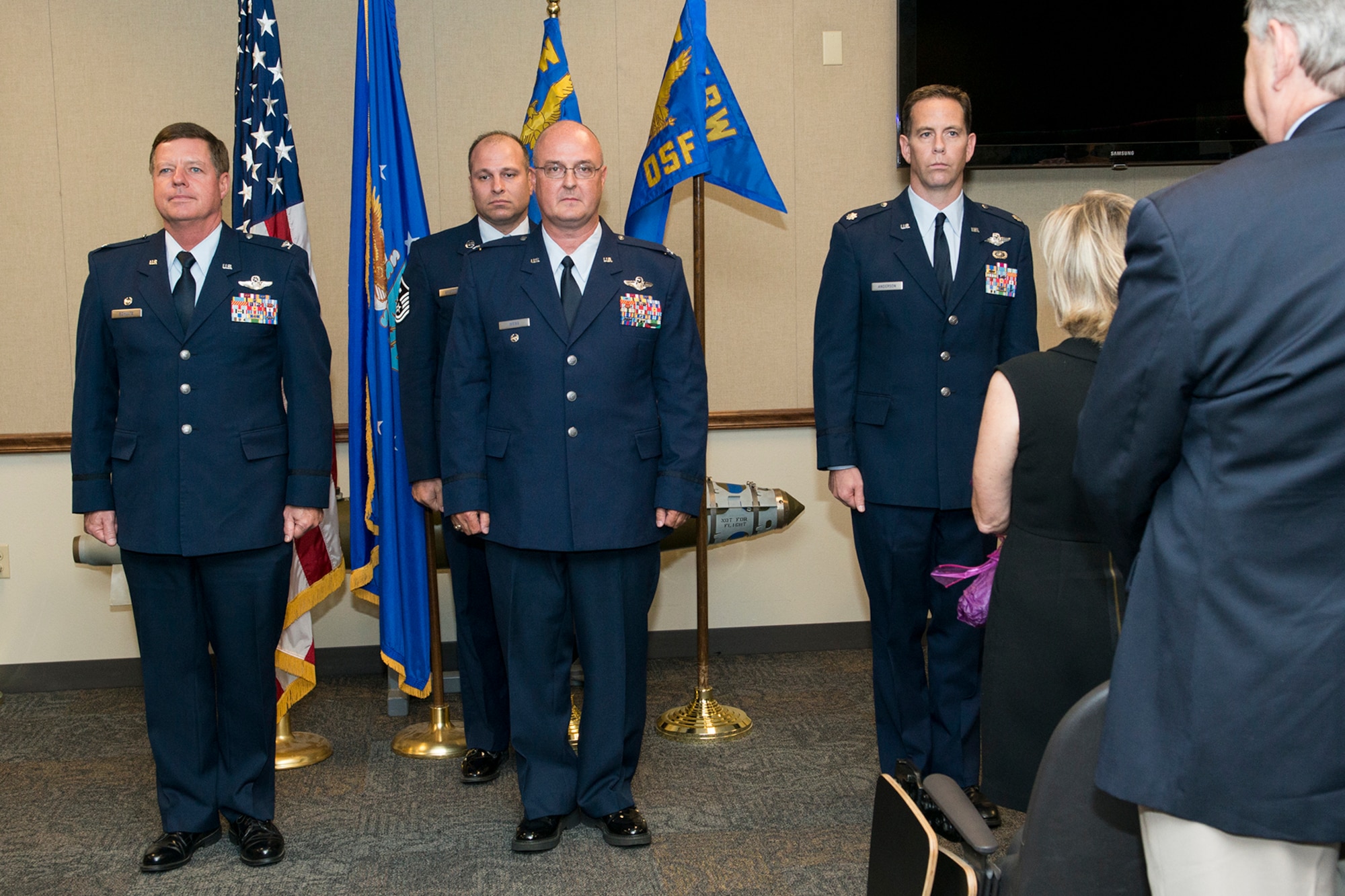 A Change of Command ceremony is held for the 307th Operations Support Squadron, Sept. 30, 2014, Barksdale Air Force Base, La. U.S. Air Force Col. David Webb (center) is relinquishing command of the squadron to Lt. Col. Christopher Anderson (right). (U.S. Air Force photo by Master Sgt. Greg Steele/Released)