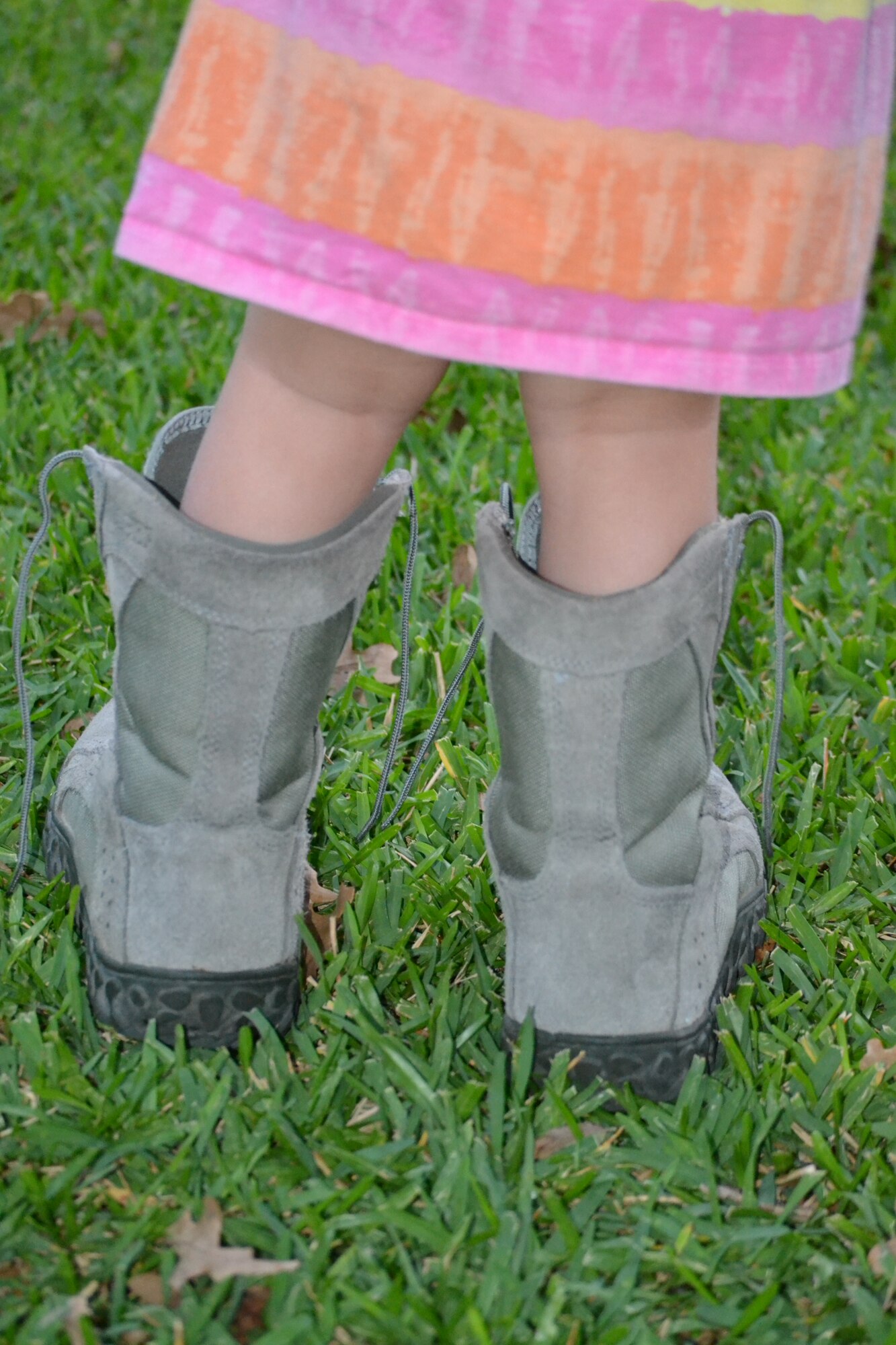 Staff Sergeant Melissa Harvey's daughter plays in her mommy's boots Thursday, Oct. 2, 2014. Sgt. Harvey is a public affairs specialist with the 301st Fighter Wing at Naval Air Station Fort Worth Joint Reserve Base, Texas. (U.S. Air Force photo by Staff. Sgt. Melissa Harvey)