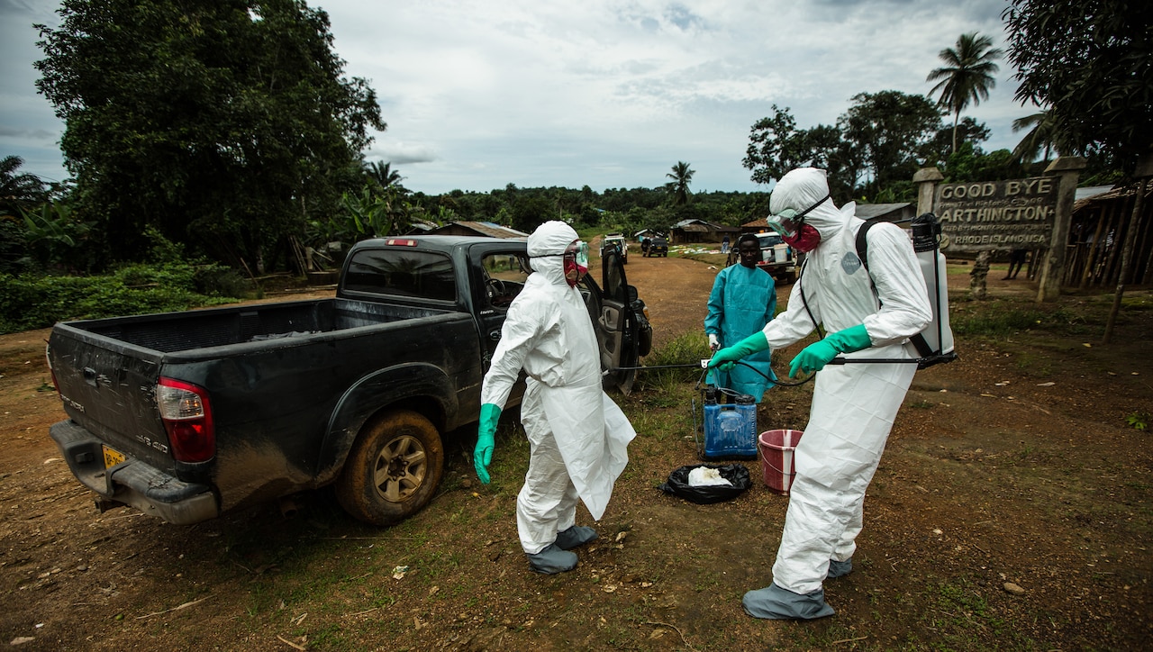 A USAID safe-burial team trained to handle the bodies of those infected with Ebola works in Monrovia, Liberia, Sept. 26, 2014. USAID photo by Morgana Wingard