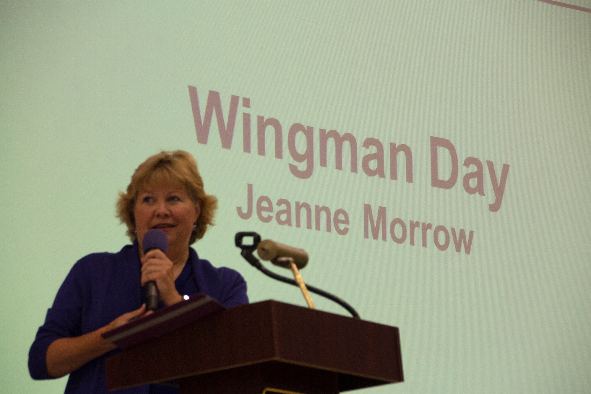 Jeanne Morrow, the new Psychological Health Program director with the 446th Aerospace Medicine Squadron, presents a briefing during this year's Wingman Day event Oct. 5 at Hangar 9. (U.S. Air Force Reserve photo by Staff Sgt. Bryan Hull)