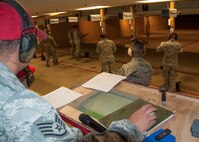 Staff Sgt. Trevor Mclelland, 419th Security Forces combat arms instructor, oversees the activities of the morning while keeping track of each commanders’ scores. (U.S. Air Force photo/Staff Sgt. Christina Judd)