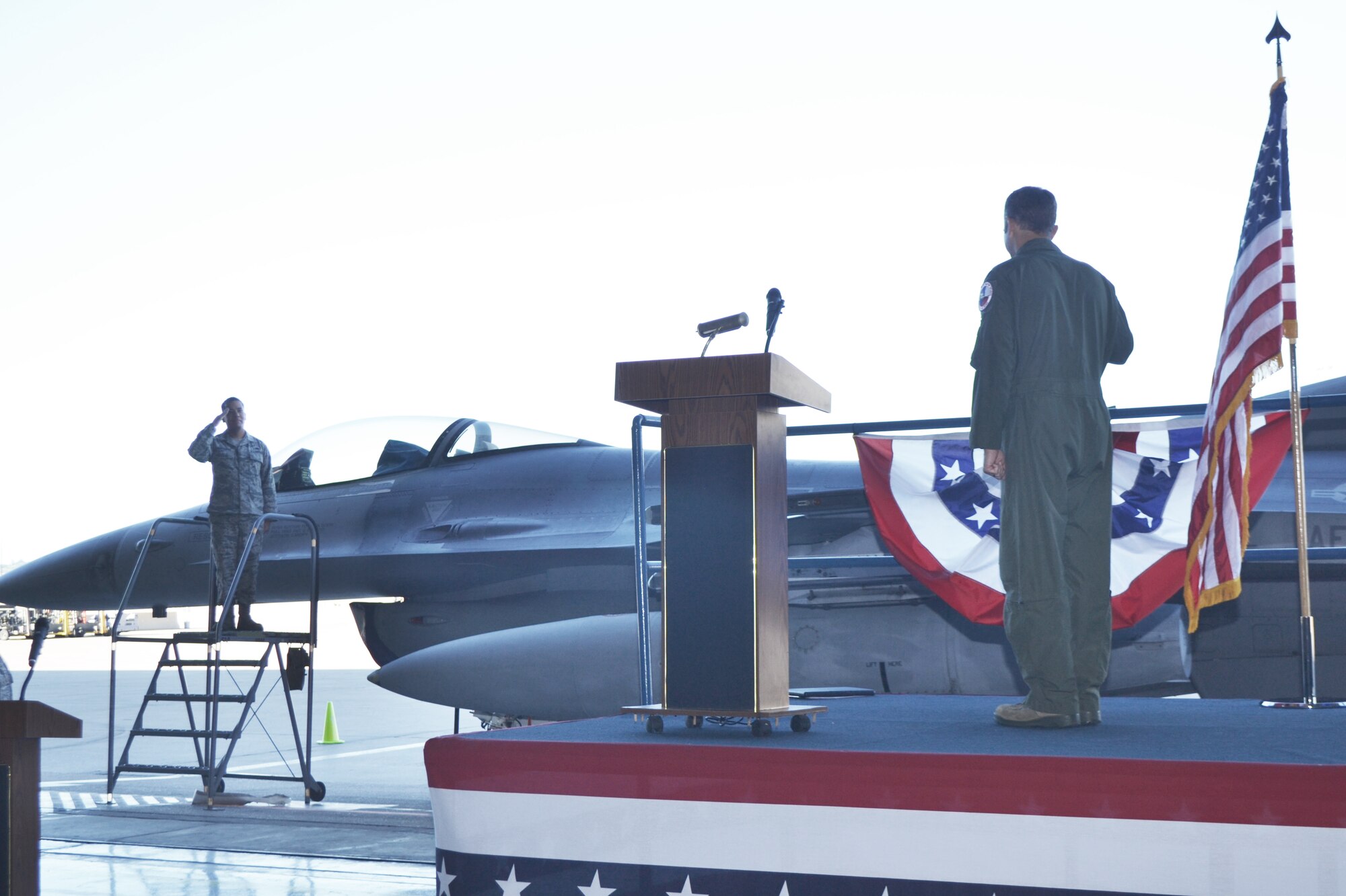 Lt. Col. Jeffrey Cunningham, new Detachment 457 commander, is saluted as his name is revealed on his jet during the Assumption of Command ceremony October 3.  Detachment 457 is an active associate unit assigned to the 301st Fighter Wing at Naval Air Station Ft. Worth Joint Reserve Base, Texas.
