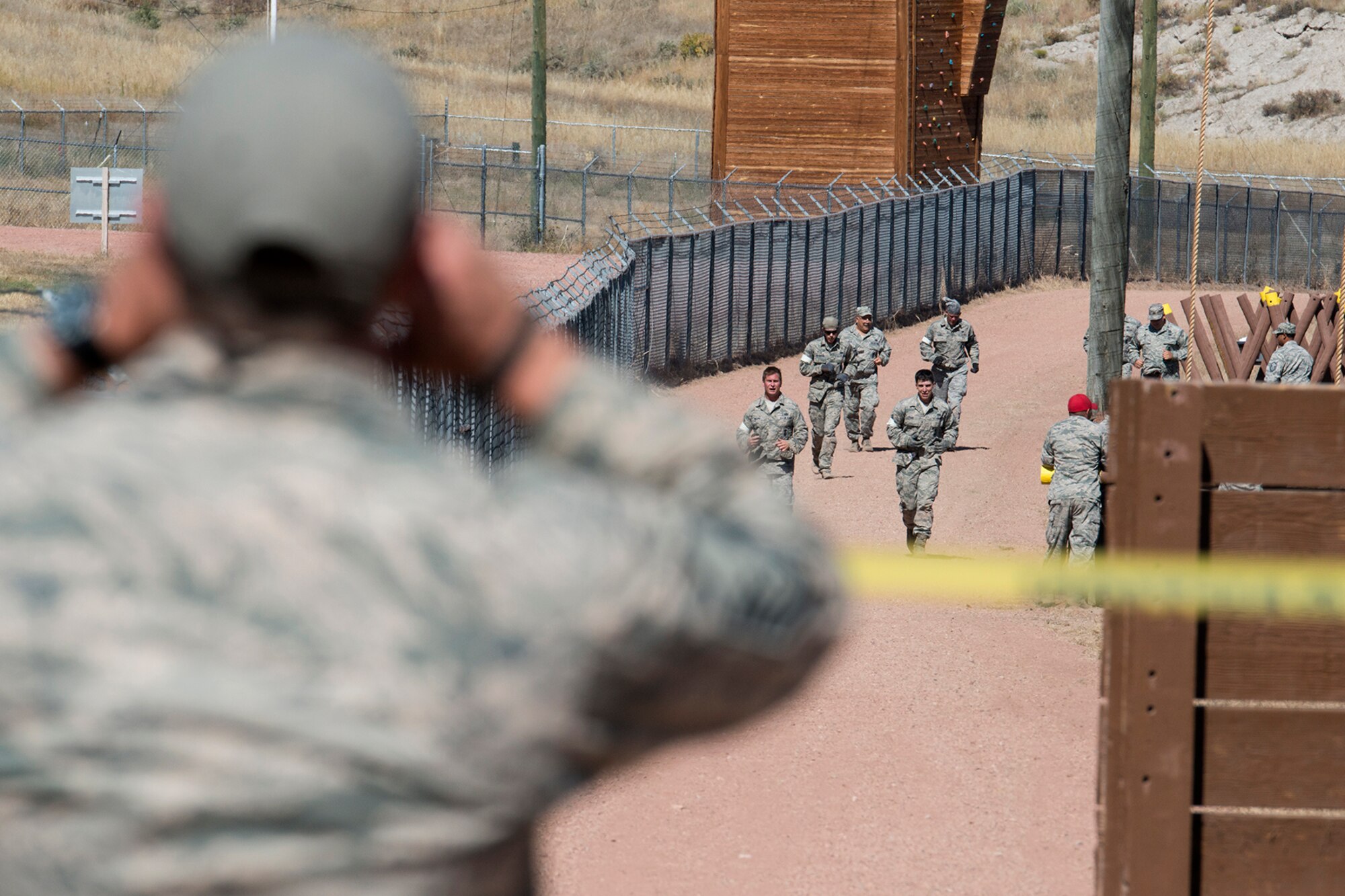 Members of the 307th Security Forces Squadron are close to completing the last leg of the Mental and Physical competition during the Global Strike Challenge, Sept. 25, 2014, Camp Guernsey, Wyo. The Global Strike Challenge is the world's premier bomber, Intercontinental Ballistic Missile, helicopter operations and security forces competition with units from Air Force Global Strike Command, Air Combat Command, Air Force Reserve Command and the Air National Guard. (U.S. Air Force photo by Master Sgt. Greg Steele/Released)