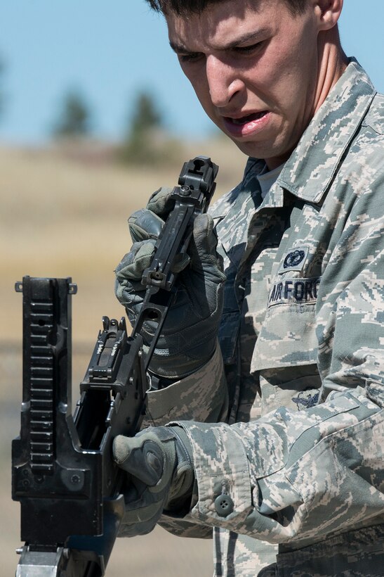 U.S. Air Force Staff Sgt. Robert Cerami, 307th Security Forces Squadron, assembles an M240 machine gun as part of the Mental and Physical competition during the Global Strike Challenge, Sept. 25, 2014, Camp Guernsey, Wyo. The Global Strike Challenge is the world's premier bomber, Intercontinental Ballistic Missile, helicopter operations and security forces competition with units from Air Force Global Strike Command, Air Combat Command, Air Force Reserve Command and the Air National Guard. (U.S. Air Force photo by Master Sgt. Greg Steele/Released)