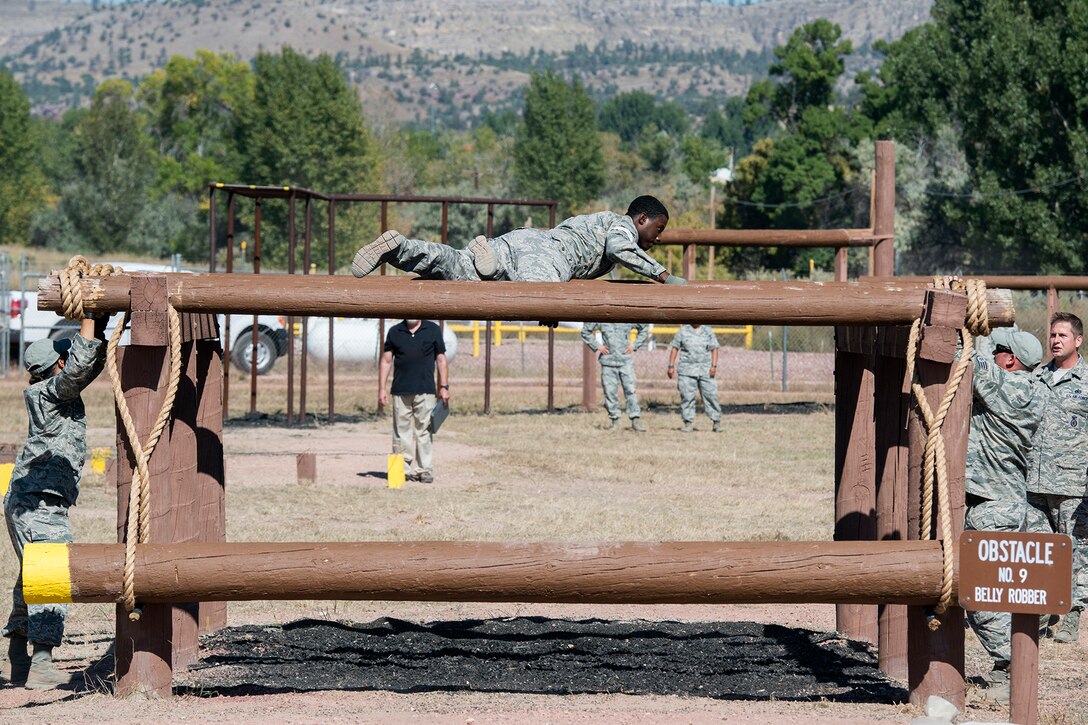 U.S. Air Force Airman First Class Michael James, 307th Security Forces Squadron, works his way over an obstacle called the Belly Robber during the Global Strike Challenge, Sept. 25, 2014, Camp Guernsey, Wyo. The Global Strike Challenge is the world's premier bomber, Intercontinental Ballistic Missile, helicopter operations and security forces competition with units from Air Force Global Strike Command, Air Combat Command, Air Force Reserve Command and the Air National Guard. (U.S. Air Force photo by Master Sgt. Greg Steele/Released)