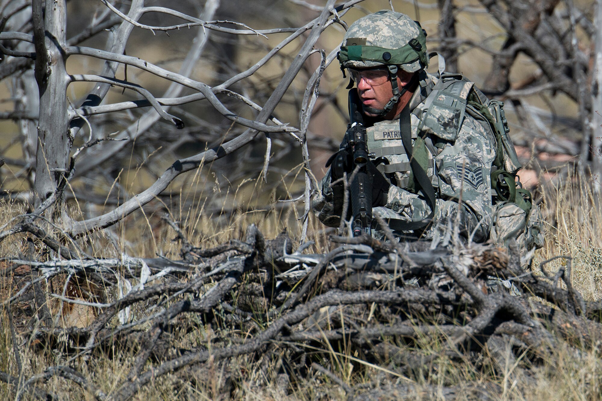 U.S. Air Force Staff Sgt. Randy Patrick, 307th Security Forces Squadron, secures his position during the Global Strike Command Tactics competition, Sept. 23, 2014, Camp Guernsey, Wyo. The Global Strike Challenge is the world's premier bomber, Intercontinental Ballistic Missile, helicopter operations and security forces competition with units from Air Force Global Strike Command, Air Combat Command, Air Force Reserve Command and the Air National Guard. (U.S. Air Force photo by Master Sgt. Greg Steele/Released)