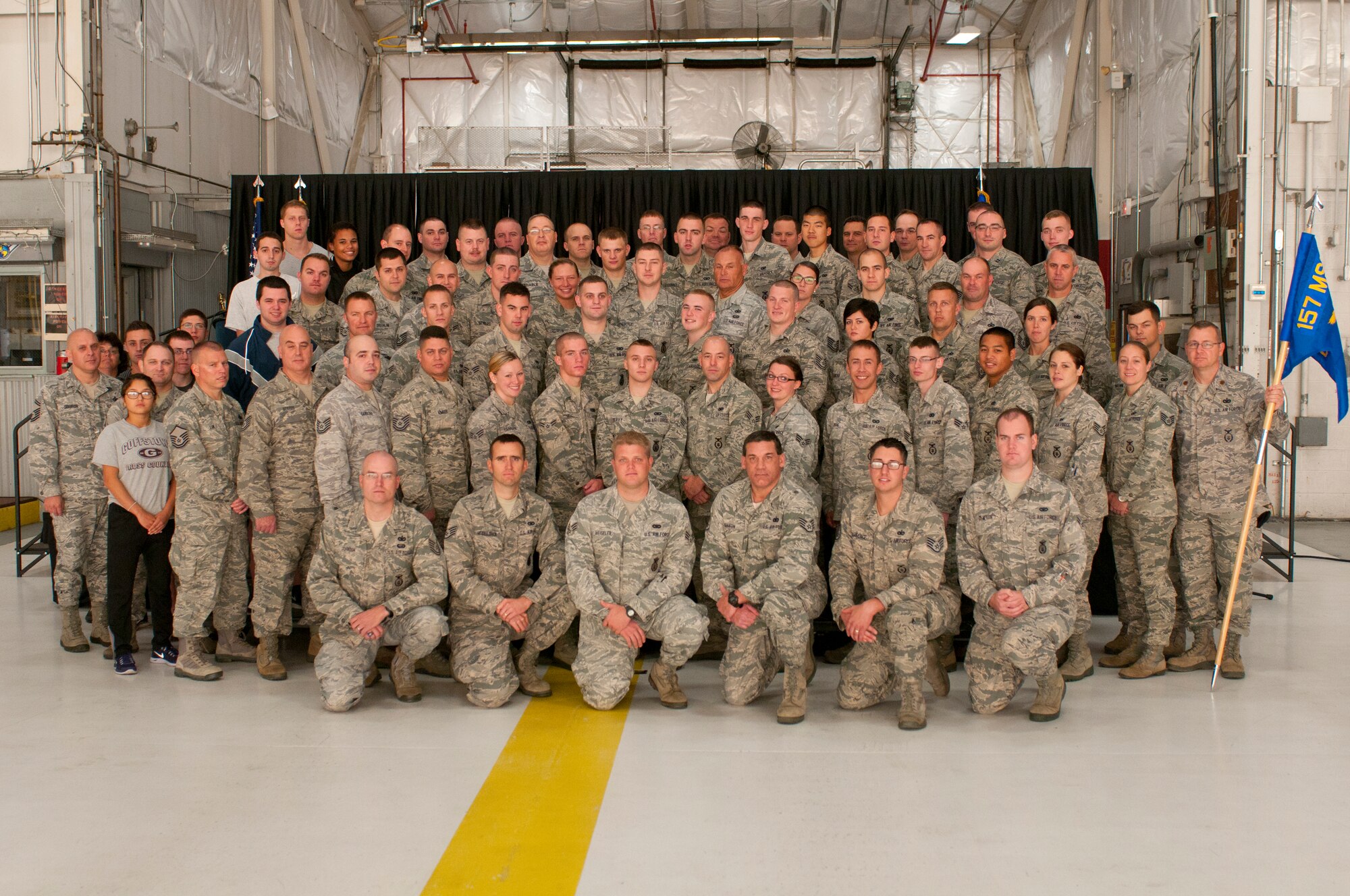 Members of the 157th Security Forces Squadron pose for a photograph after the squadron's change of command ceremony at Pease Air National Guard Base, N.H. Oct. 3, 2014.  Maj. Kenneth Leedberg relinquished command of the squadron to Maj. Jassen Bluto. (U.S. Air National Guard photo by Staff Sgt. Curtis J. Lenz)