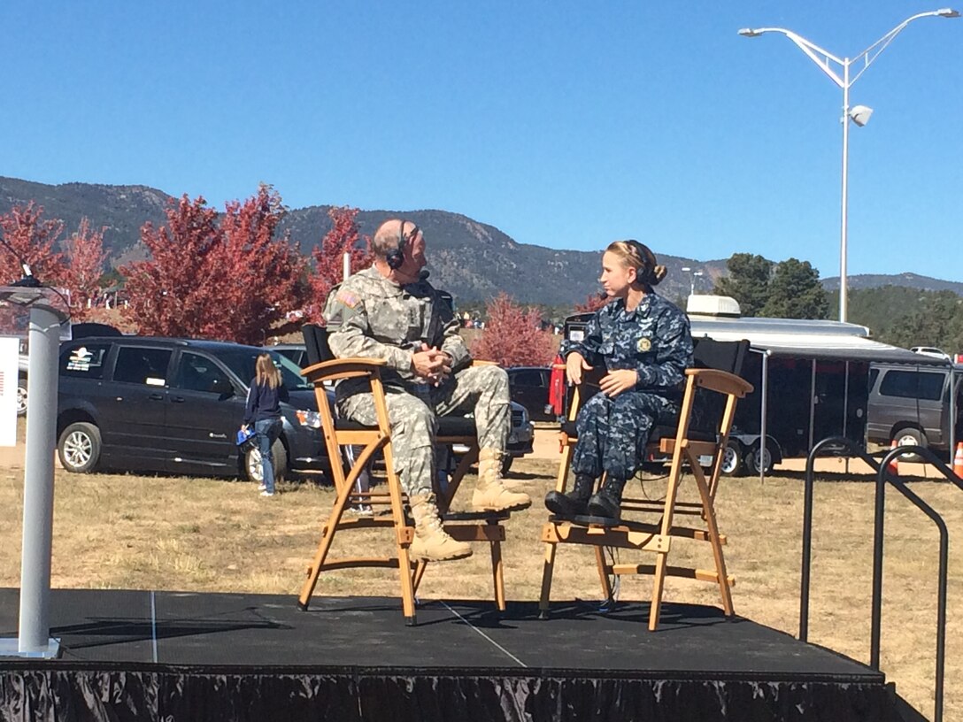 Army Gen. Martin E. Dempsey, left, chairman of the Joint Chiefs of Staff, praises Warrior Games competitors while speaking with Navy Petty Officer 1st Class Brandie Wills during the final live broadcast of DoD News’ Adaptive Warrior show at Falcon Stadium in Colorado Springs, Colo., Oct. 4. DoD photo by Army Sgt. 1st Class Tyrone C. Marshall Jr.