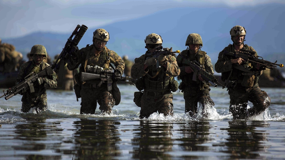 Philippine and U.S. Marines assault the beach during a simulated raid during Amphibious Landing Exercise 15 in Palawan, the Philippines, October 2, 2014. PHIBLEX is an annual, bilateral training exercise conducted by the Armed Forces of the Philippines alongside U.S. Marine and Navy forces focused on strengthening the partnership and relationships between the two nations across a range of military operations including disaster relief and complex expeditionary operations. The U.S. Marines are with Company L, Battalion Landing Team 3rd Battalion, 5th Marines, 31st Marine Expeditionary Unit, 3rd Marine Expeditionary Brigade.
