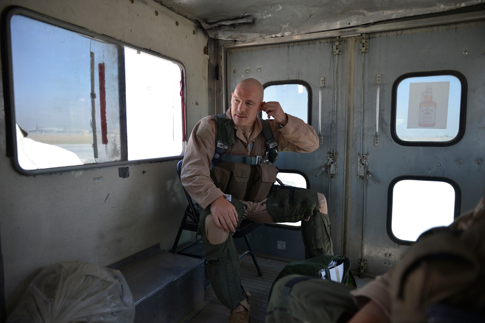 U.S. Air Force Maj. Vincent Sherer, 455th Air Expeditionary Wing pilot, rides to the flightline for a sortie at Bagram Airfield, Afghanistan Aug. 5, 2014.  Sherer flies the A-10 Thunderbolt II to provide overwatch and close air support to ground forces. Sherer is deployed from Davis-Monthan Air Force Base, Ariz. and a native of Portland, Ore. (U.S. Air Force photo by Staff Sgt. Evelyn Chavez/Released)