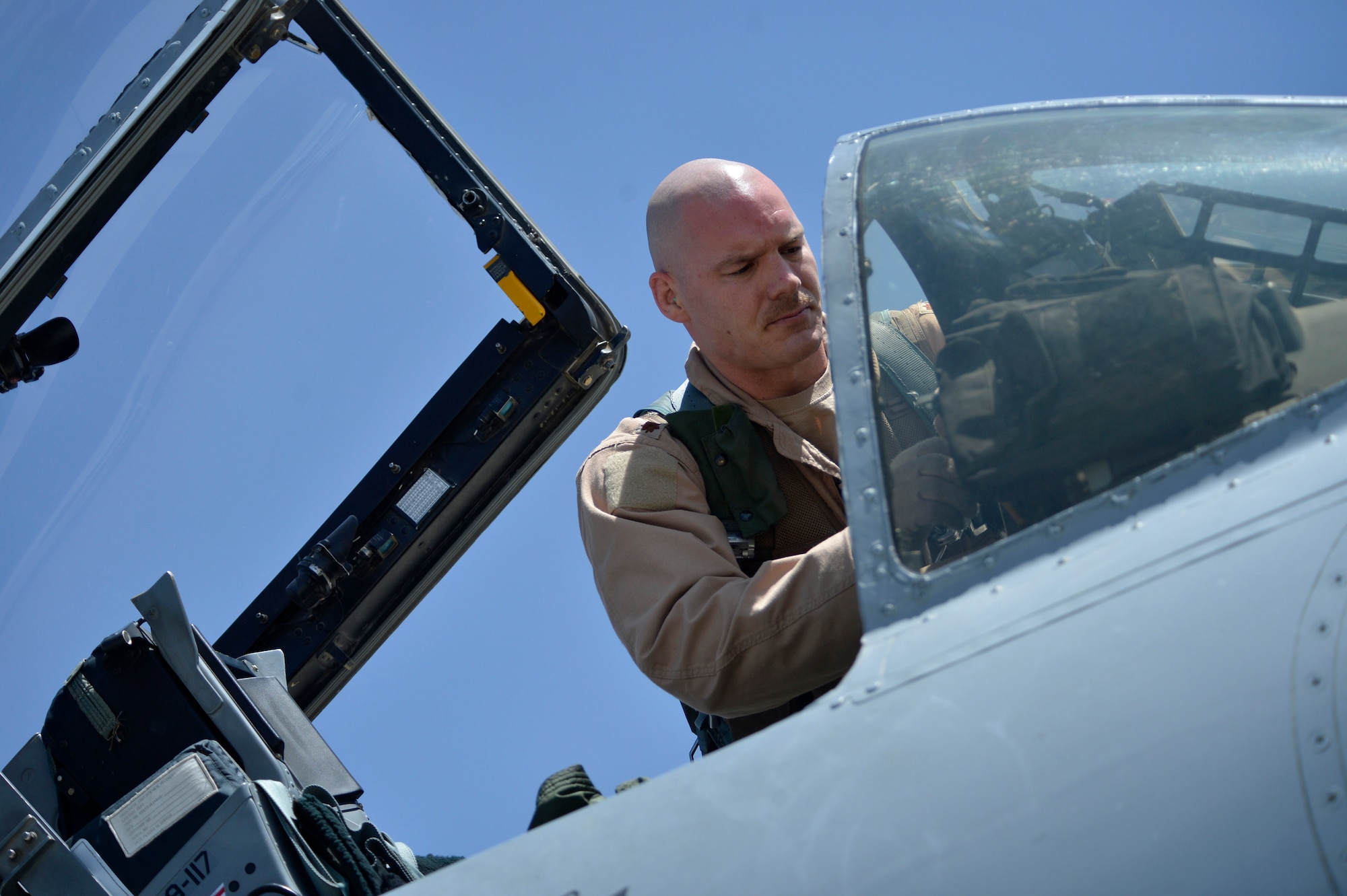 U.S. Air Force Maj. Vincent Sherer, 455th Air Expeditionary Wing pilot, prepares for a sortie at Bagram Airfield, Afghanistan Aug. 5, 2014.  Sherer flies the A-10 Thunderbolt II, a specialized ground-attack aircraft that provides close air support to ground forces operating in Afghanistan.  He is deployed from Davis-Monthan Air Force Base, Ariz. and a native of Portland, Ore. (U.S. Air Force photo by Staff Sgt. Evelyn Chavez/Released)