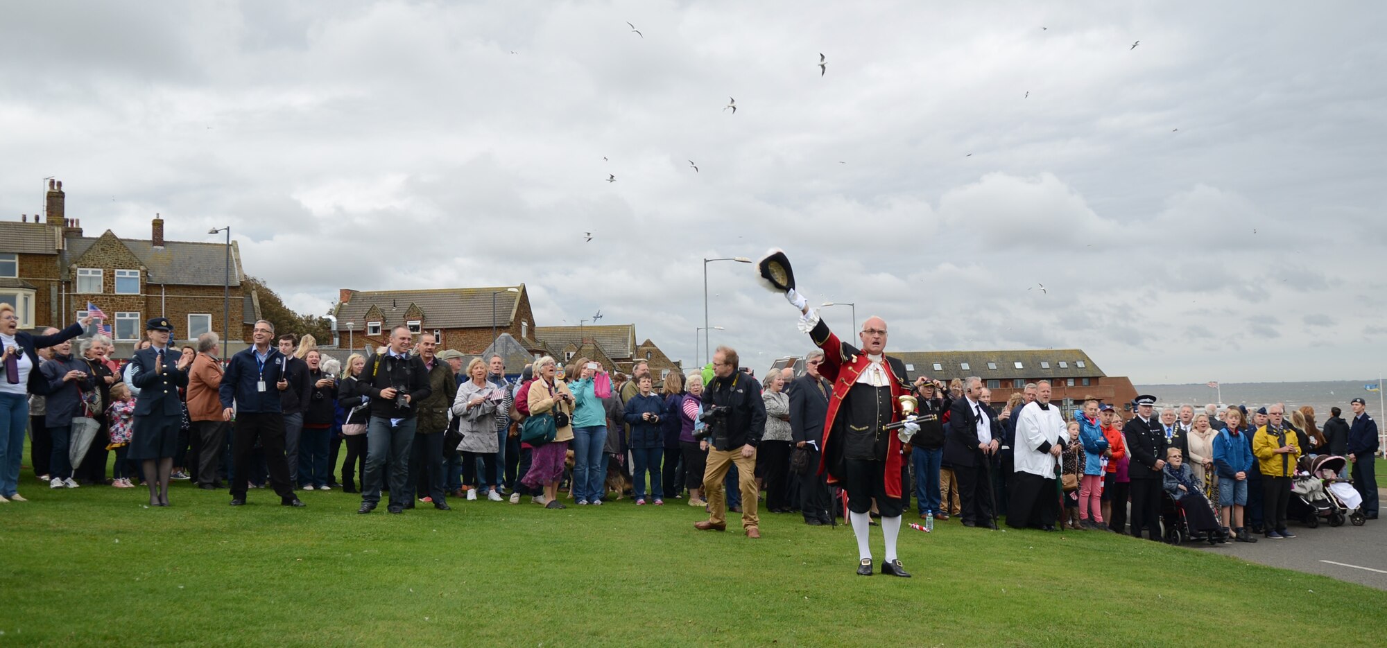 Hunstanton townspeople cheer after honoring the 67th Special Operation Squadron in a ceremony Oct. 4, 2014, at Hunstanton, England. The parade serves to mark both the depth of Hunstanton’s gratitude and the strength of the relationship that has developed between the seaside town and the 67th SOS over the years. (U.S. Air Force photo/Airman 1st Class Kyla Gifford/Released)