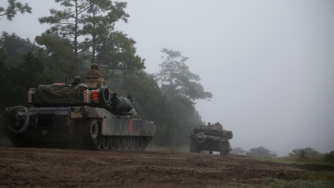 Tanks from Alpha Co., 2nd Tank Battalion, 2nd Marine Division line up for a breach at Landing Zone Falcon, Marine Corps Base Camp Lejeune, N.C., Oct. 1, 2014. The tanks moved past an obstacle in order to assault a simulated enemy on the other side of that obstacle. The purpose of the three-day field exercise was for the Marines to work on tank fundamentals in the offense and defense.