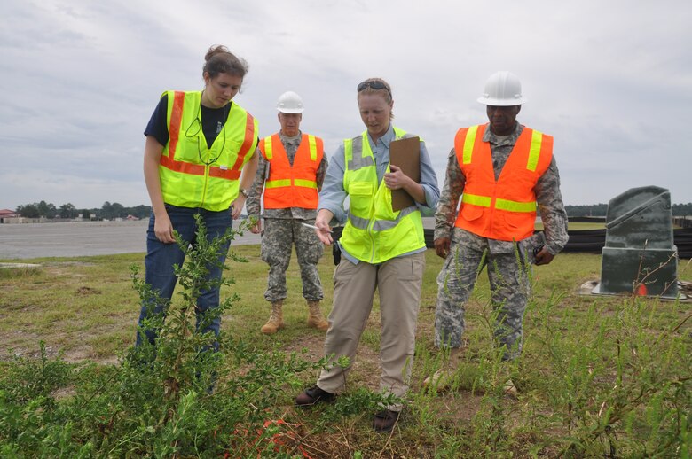 Piper Bazemore, Sgt. Maj. Mark Andrews, Sue Wilcox and Command Sgt. Maj. Antonio Jones (left to right) conduct an airfield assessment during training exercises on Hunter Army Airfield held Sept. 22. During the last week of training, members split into two teams to conduct collective training exercise which included airfield assessments and bridge reconnaissance. The 542nd Engineer Detachment Forward Engineering Support Team - Advanced is ensuring deployment readiness by January 2015 (USACE photo by Chelsea Smith). 
