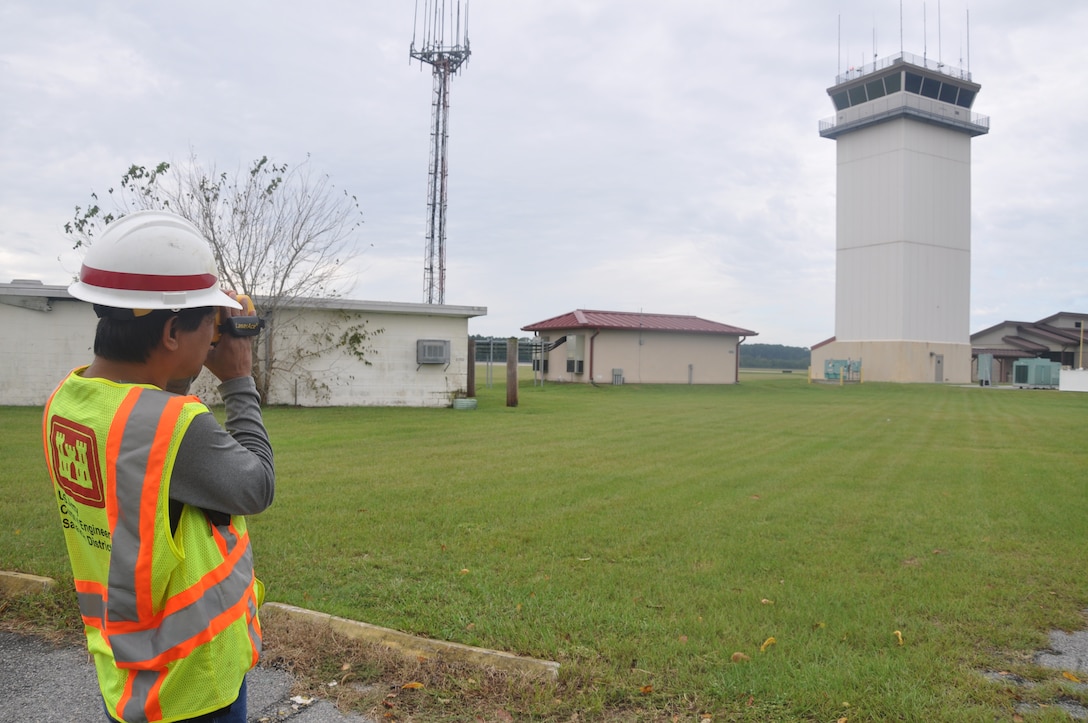 Arnold Taganas, 542nd Engineer Detachment Forward Engineering Support Team - Advanced (FEST-A) mechanical engineer, uses a laser finder to obtain measurements of the air traffic control tower located on Hunter Army Airfield during a training exercise held Sept. 22 (USACE photo by Chelsea Smith). 