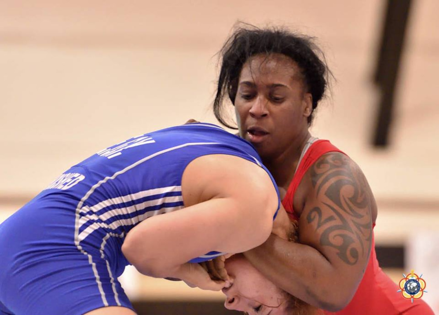 Army Sgt. Randi Miller wraps up Enas Mostafa Yousef (Egypt) during the 69kg Women's Freestyle competition at the 29th CISM World Military Wrestling Championship at Joint Base McGuire-Dix-Lakehurst, New Jersey 1-8 October 2014