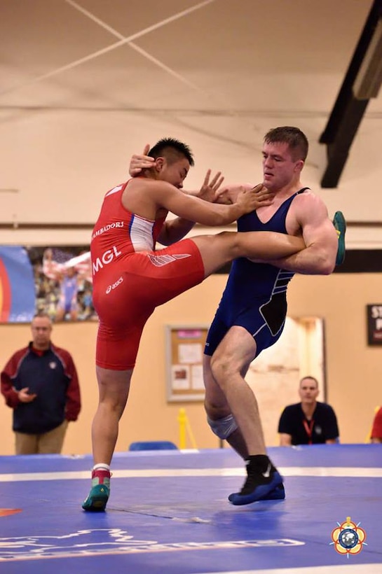 Army Sgt. Moza Fay takes control during his silver medal performance during the 74kg Freestyle competition at the 29th CISM World Military Wrestling Championship at Joint Base McGuire-Dix-Lakehurst, New Jersey 1-8 October 2014