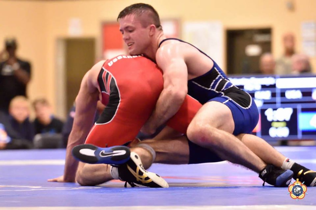 Army Sgt. Moza Fay wraps his opponent up during the 74kg Freestyle competition at the 29th CISM World Military Wrestling Championship at Joint Base McGuire-Dix-Lakehurst, New Jersey 1-8 October 2014
