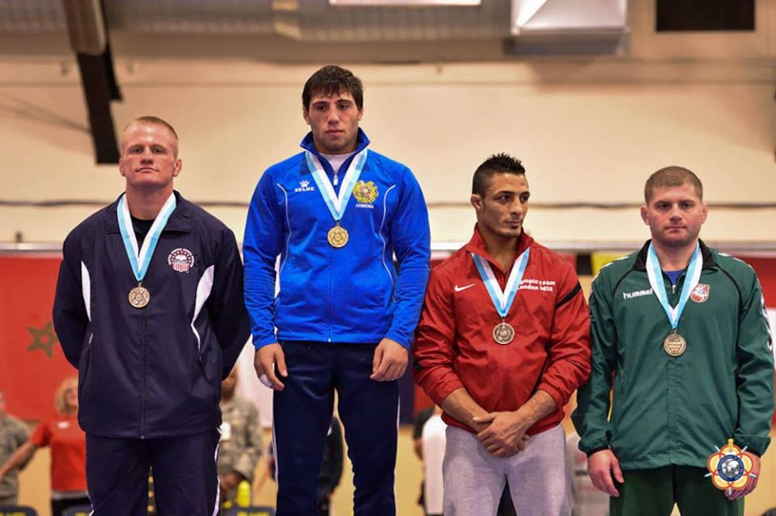 Army Capt. Jon Anderson (far left) proudly displays his silver medal of the 75kg Greco-Roman competition at the 29th CISM World Military Wrestling Championship at Joint Base McGuire-Dix-Lakehurst, NJ 1-8 October 2014.
Gold – Karapat Chalyan (Armenia)
Silver - Jon Anderson (USA)
Bronze - Valdemaras Venckaitis (Lithuania)
Bronze – Abdou Omar Ahmed (Egypt)