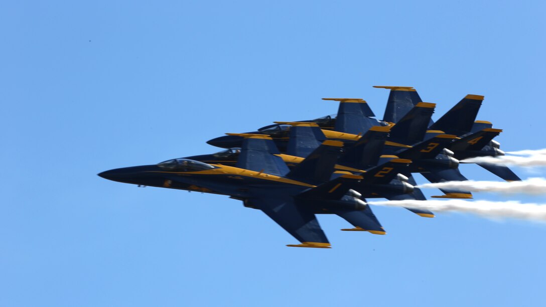 The Navy Blue Angels fly in formation during the 2014 Marine Corps Air Station Miramar Air Show, Oct. 3. The Blue Angels is comprised of 16 officers who serve voluntarily.