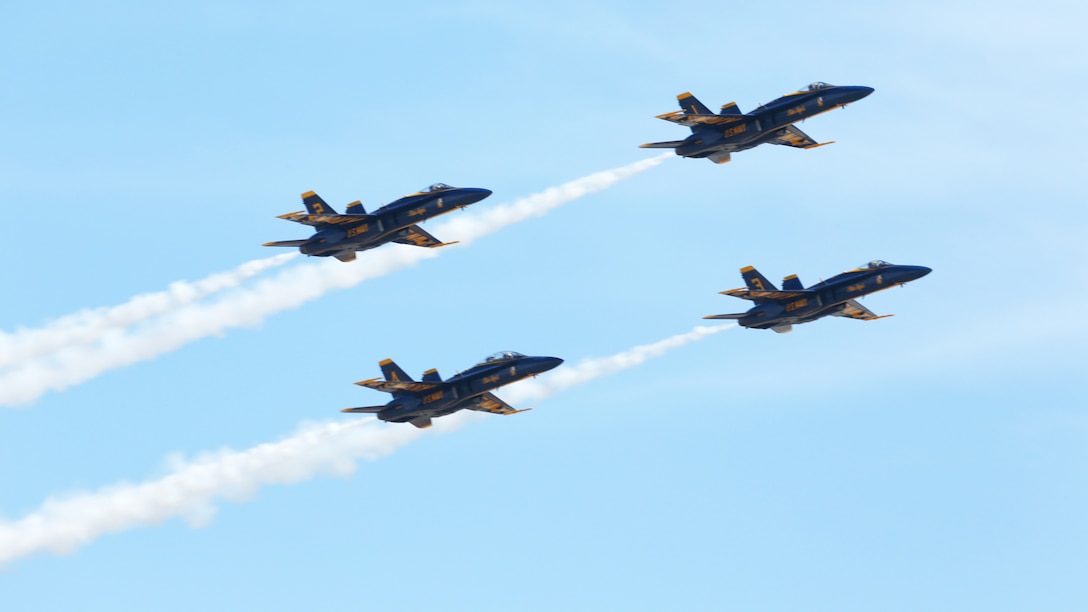 The Navy Blue Angels fly in formation during the 2014 Marine Corps Air Station Miramar Air Show, Oct. 3. The Blue Angels is comprised of 16 officers who serve voluntarily.