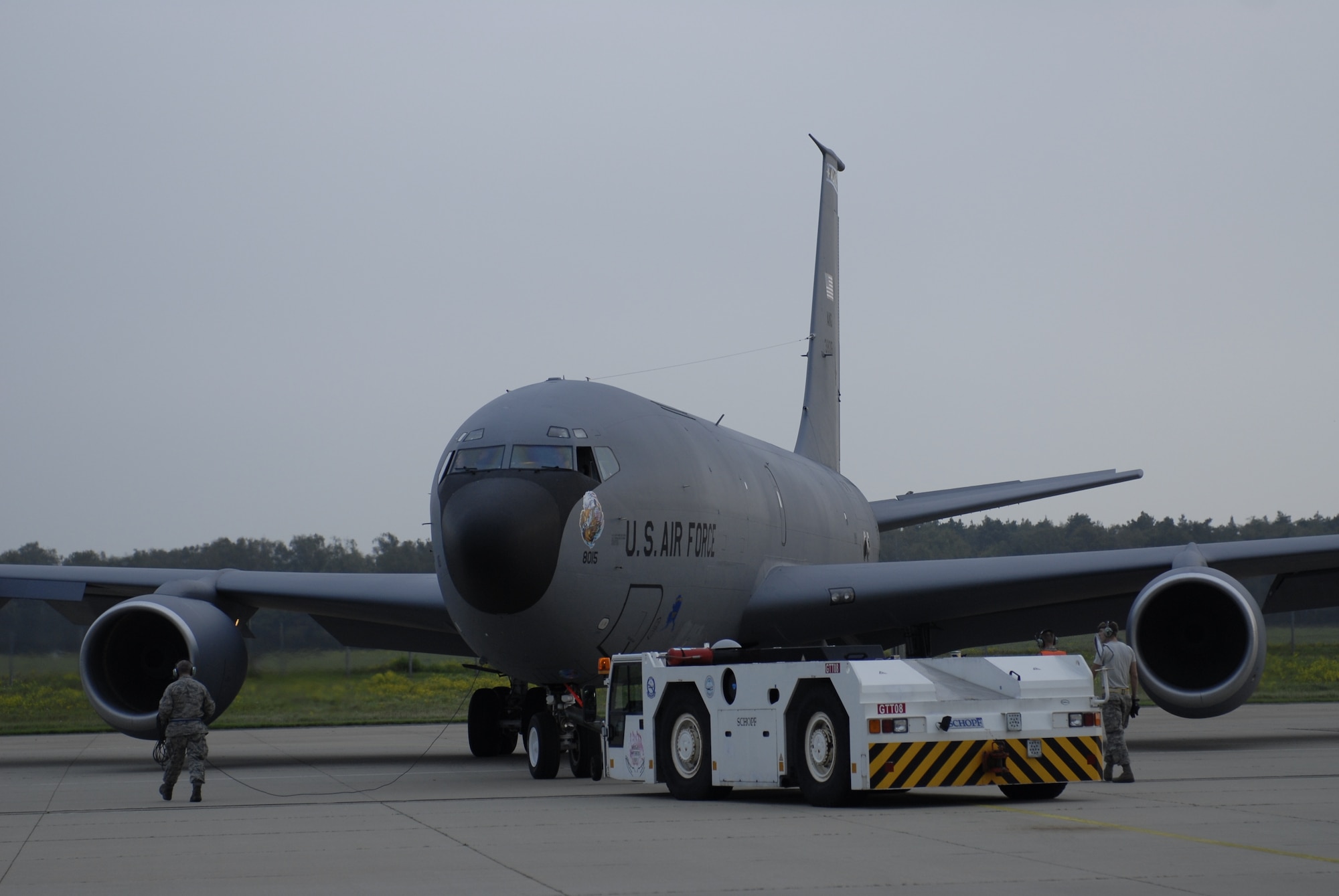 A 168th Air Refueling Wing KC-135 Stratotanker is pushed backward by a tow truck prior to takeoff Sept. 30, 2014, at Geilenkirchen NATO Air Base, Germany. The aircraft carries 125,000 lbs. of fuel and will offload 30,000 to 35,000 lbs. to receiving Boeing E-3A AWACS. (U.S. Air National Guard photo/Senior Airman Francine St. Laurent)
