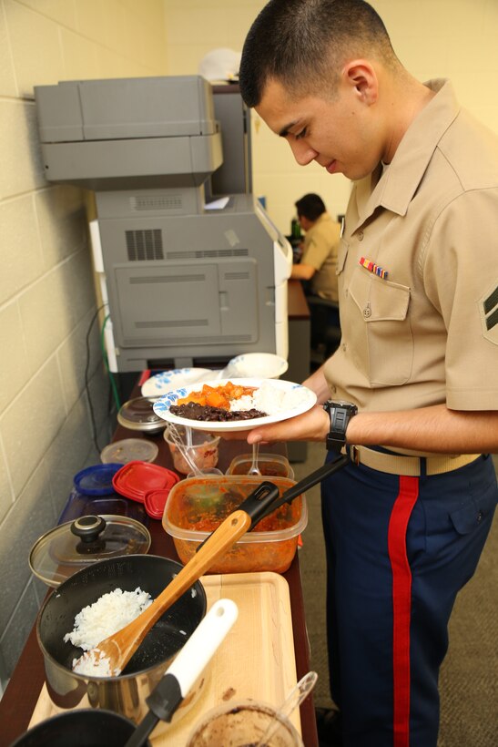 Cpl. Luis Nietosoto, adjutant clerk with the 9th Marine Corps District,
celebrates National Hispanic Heritage Month with a homemade Hispanic meal,
Sep. 26, 2014. National Hispanic Heritage Month extends from Sep. 15 to Oct.
15 and is intended to recognize the contributions of Hispanic and Latino
Americans.
