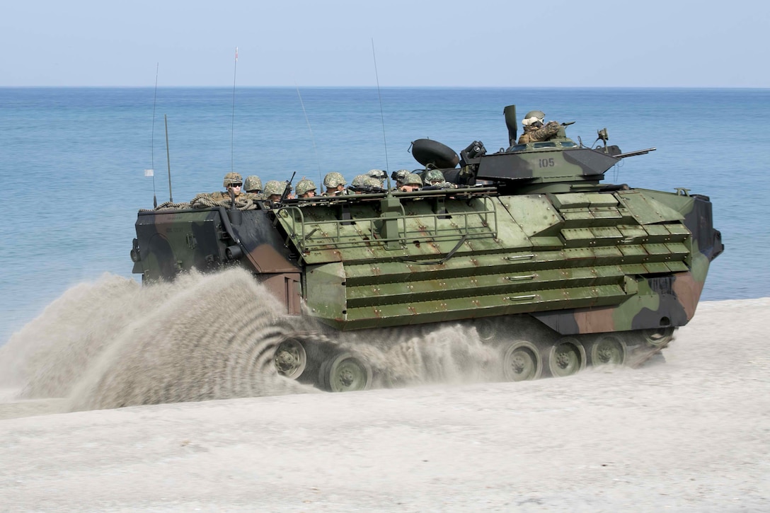 Philippine and U.S. Marines aboard a U.S. Marine Amphibious Assault Vehicle take part in a mechanized assault during Amphibious Landing Exercise 15 at Naval Education and Training Command, Zambales, Luzon, Philippines, Oct. 5. PHIBLEX is an annual, bilateral training exercise conducted by members of the Armed Forces of the Philippines alongside U.S Marine and Navy forces focused on strengthening the partnership and relationships between the two nations across a range of military operations including disaster relief and complex expeditionary operations. The U.S. Marines are with Company I, Battalion Landing Team 3rd Battalion, 5th Marines, 31st Marine Expeditionary Unit, 3rd Marine Expeditionary Brigade. The Philippine Marines are with 4th Marine Company, Battalion Landing Team - 9.