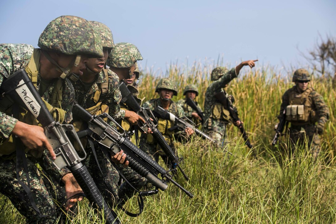 NAVAL EDUCATION AND TRAINING COMMAND, ZAMBALES, LUZON, Philippines – Philippine and U.S. Marines assault their objective during a mechanized assault as part of Amphibious Landing Exercise 15 at Naval Education Training Command, Zambales, Luzon, Philippines, Oct. 5. PHIBLEX is an annual, bilateral training exercise conducted by members of the Armed Forces of the Philippines alongside U.S Marine and Navy forces focused on strengthening the partnership and relationships between the two nations across a range of military operations including disaster relief and complex expeditionary operations.. The U.S. Marines are with Company I, Battalion Landing Team 3rd Battalion, 5th Marines, 31st Marine Expeditionary Unit, 3rd Marine Expeditionary Brigade. The Philippine Marines are with 4th Marine Company, Battalion Landing Team - 9. 