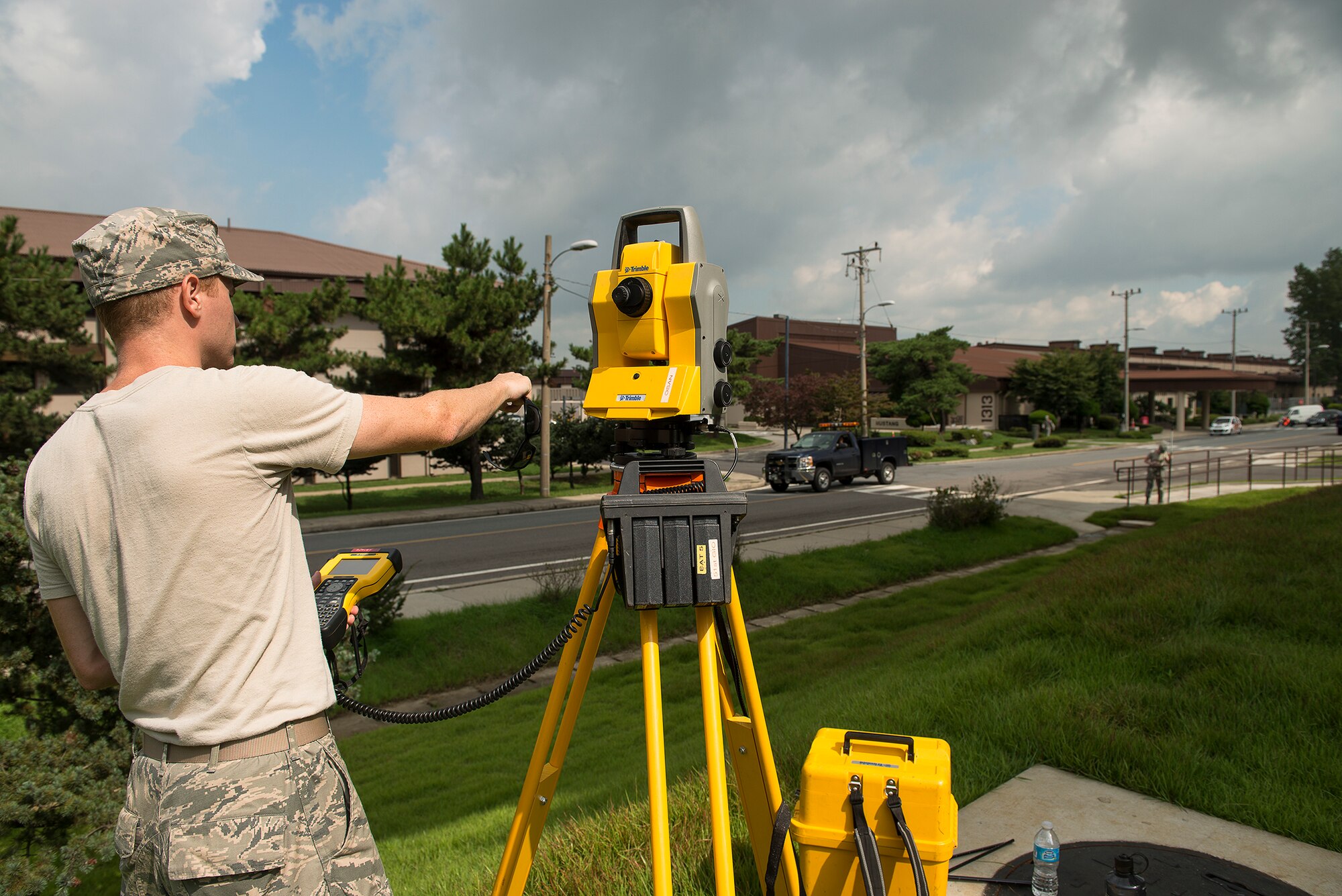 Airman 1st Class Andrew Riesenberger, a 51st Civil Engineer Squadron engineering technician, gathers information during a mapping job Sept. 4, 2014, at Osan Air Base, Republic of Korea. Riesenberger and his coworkers provide maps for the entire base, which have to be updated periodically, such as when a new buildling is erected.(U.S. Air Force photo by Staff Sgt. Jake Barreiro/Released)