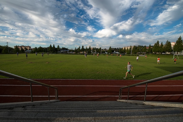 Airman 1st Class Andrew Riesenberger, a 51st Civil Engineer Squadron engineering technician, runs around the soccer field Sept. 9, 2014, at Osan Air Base, Republic of Korea. Riesenberger prefers to run alone, and has a set regimen in order to prepare for races. (U.S. Air Force photo by Staff Sgt. Jake Barreiro/Released)