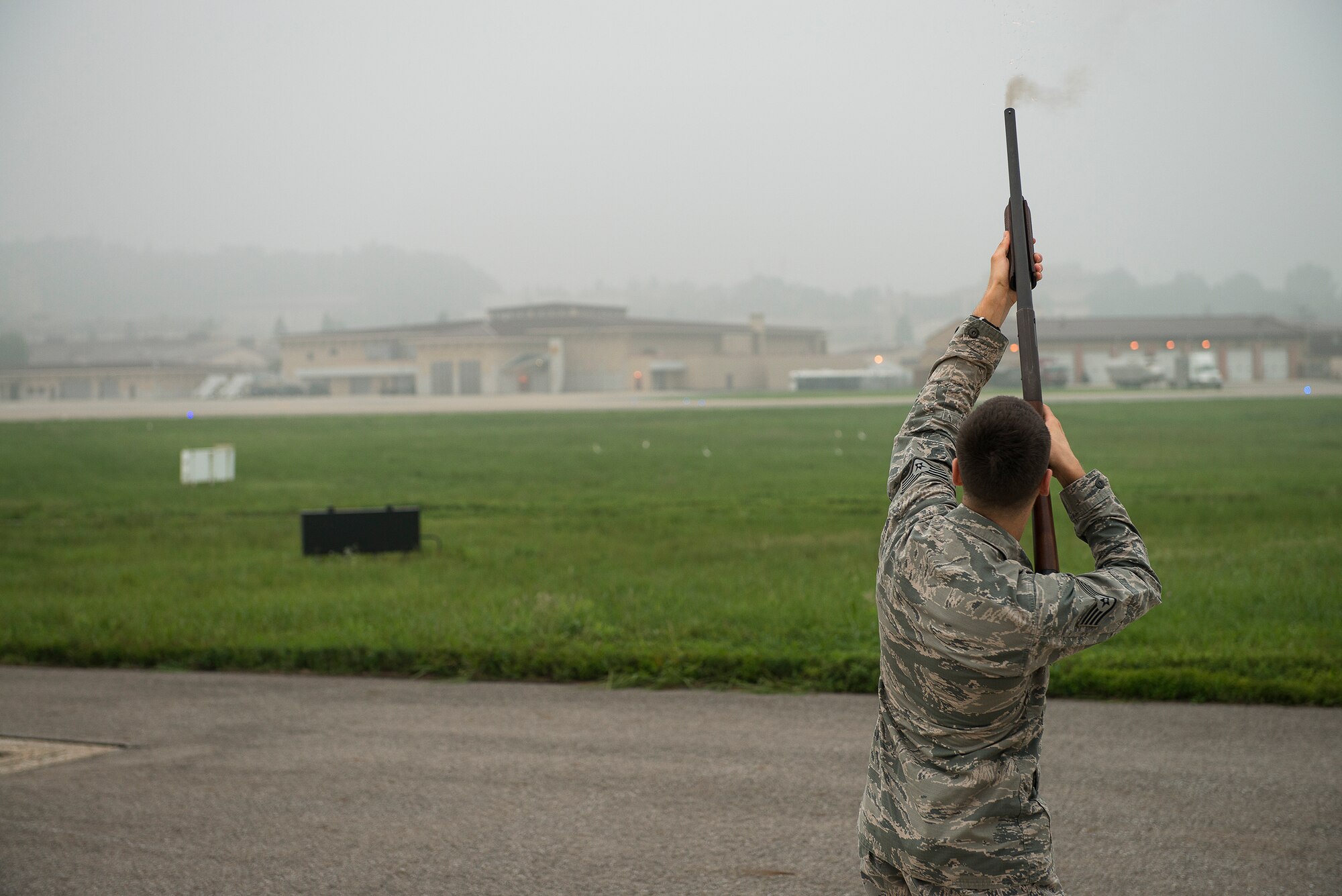 Staff Sgt. Joshua Johnson, a 51st Operations Support Squadron airfield management operations supervisor, fires a blank round into the air to ward birds off of the flight line Aug. 23, 2014, at Osan Air Base, Republic of Korea. As part of the airfield management team, Johnson is responsible for ensuring birds stay away from the flight line during after-duty and weekend hours. (U.S. Air Force photo by Staff Sgt. Jake Barreiro/Released)
