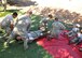 A litter team from the 940th Aerospace Medicine Squadron sets down a ‘patient’ with a simulated leg injury while two other 'patients' watch at a Mass Casualty Exercise, Oct. 5, 2014, Beale Air Force Base, Calif. The red tarp symbolized one of the different sections of triage.  Triage is a medical term for sorting patients according to a system of priorities designed to maximize the number of survivors.  The red tarp indicated that the patients are seriously injured and required immediate transport. (U.S. Air Force photo by Tech. Sgt. Heather Skinkle/Released)