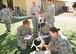 A team of 940th Aerospace Medicine Squadron members assess a 'patient' with a simulated eye injury while another player simulating Post Traumatic Stress Disorder tries distracts the team at a Mass Casualty Exercise, Oct. 5, 2014, Beale Air Force Base, Calif. The scenario is of a simulated generator explosion and required a dozen ‘patients.’ The medical staff on hand ranged from nurses, dental and laboratory technicians, to administrative personnel. The Mass Casualty Exercise is an annual requirement designed to better prepare each Reservist on how to properly triage multiple wounded during a real emergency. Triage is a medical term for sorting patients according to a system of priorities designed to maximize the number of survivors.  (U.S. Air Force photo by Tech. Sgt. Heather Skinkle/Released)