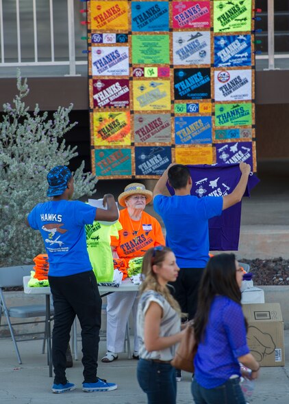 Members of Team Holloman check out products for sale during the annual Thanks Team Holloman event at Holloman Air Force Base, N.M., Oct. 3. The annual event is hosted by civic leaders, the Committee of 50, and local businesses from Alamogordo to show their appreciation to the hundreds of Holloman members that attended. (U.S. Air Force photo by Airman 1st Class Aaron Montoya / Released)