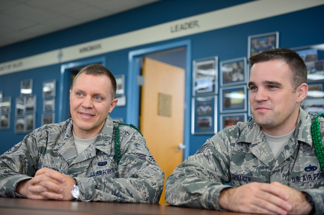 MCGHEE TYSON AIR NATIONAL GUARD BASE, Tenn.  - Airman Leadership School nominees for the Paul H. Lankford Enlisted PME Center's Leadership Award, Senior Airman Forrest Leach and Staff Sgt. Michael Minahan, talk with a classmate outside the Commandant's Office here Oct. 6, 2014, at the I.G. Brown Training and Education Center. The Center will announce award winners at their graduation ceremony. (U.S. Air National Guard photo by Master Sgt. Mike R. Smith/Released)