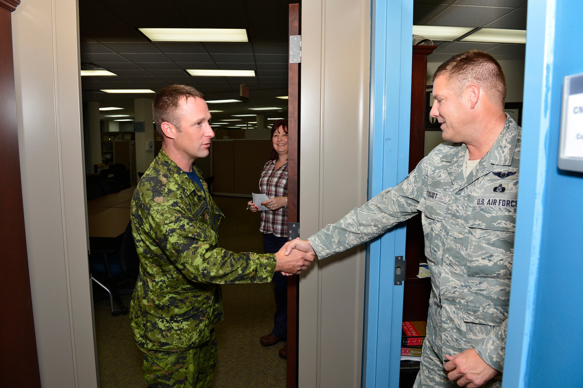 MCGHEE TYSON AIR NATIONAL GUARD BASE, Tenn.  - Canadian Sergeant Brian Standing shakes hands with Chief Master Sgt. Thomas "TK" Stoudt, commandant of the Paul H. Lankford Enlisted PME Center here Oct. 6, 2014, at the I.G. Brown Training and Education Center. Standing was attending U.S. Air Force NCO Academy and interviewed for the Commandant Award. (U.S. Air National Guard photo by Master Sgt. Jerry Harlan/Released)