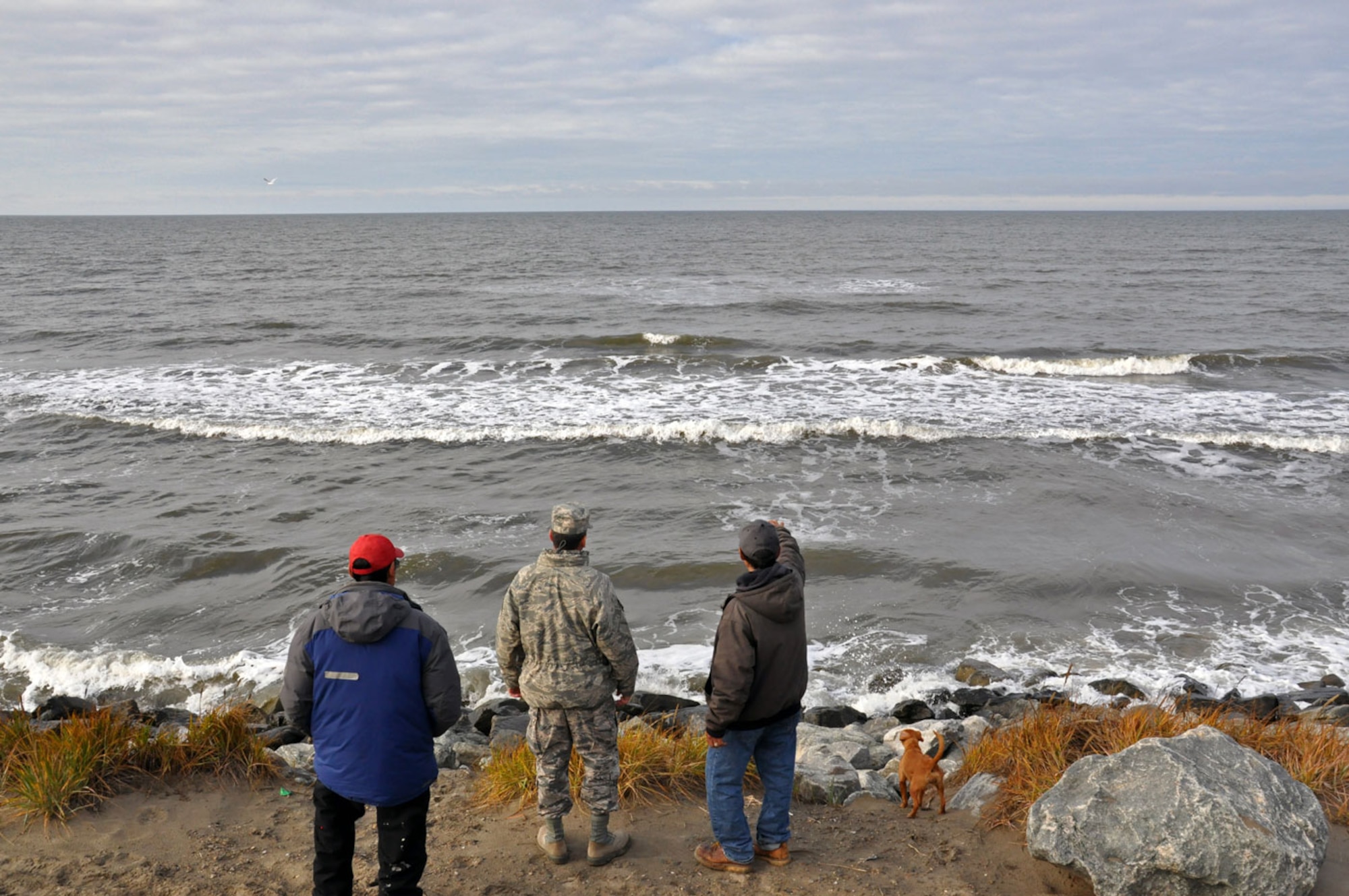 U.S. Air Force Lt. Gen. Russell Handy, Alaskan Command commander, discusses erosion with Johnson Eningowuk, Native Village of Shishmaref president, during a trip to western Alaska October 1, 2014. Alaskan Command leadership was able to gain insight on the life and challenges of Alaska Native Tribes and tour and meet with the residents of the native villages of Wales and Shishmaref as well as the Nome Eskimo Community. (U.S. Air Force photo/Capt. Anastasia Wasem)