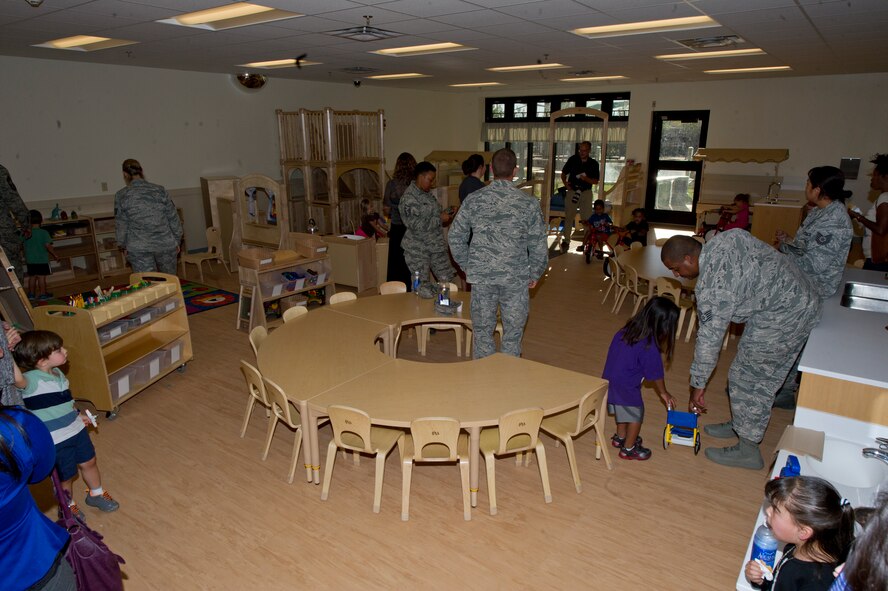Parents and children enrolled in the new Child Development Center explore the newer classrooms and all they have to offer at Holloman Air Force Base, N.M. Oct. 1. The new CDC is an organization accredited through the National Association for the Education of Young Children. The facility will still offer extended hours for military exercises, is located close to work and home, offers family discounts, and the staff are trained and certified on a recurring basis. (U.S. Air Force photo by Staff Sgt. E’Lysia Wray/Released)