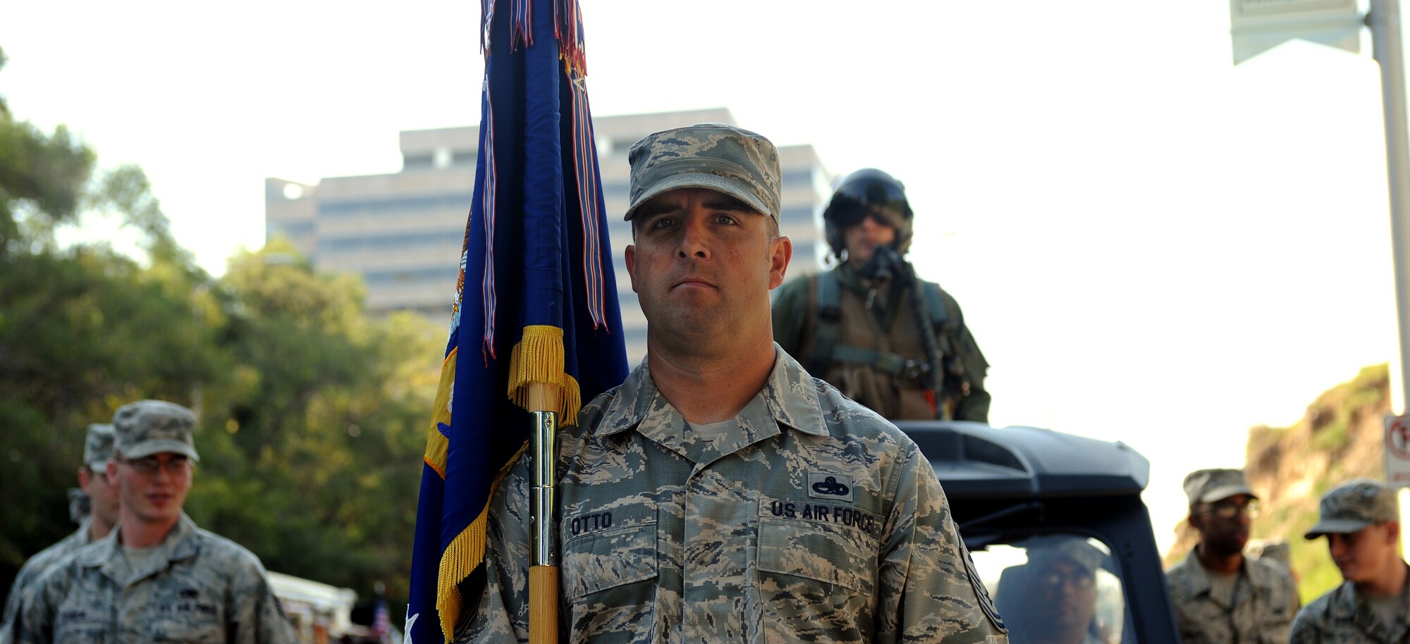 Airmen of Whiteman Air Force Base, Mo. prepare to march as the American Royal Parade begins Sept. 27, 2014, in Kansas City, Mo. Approximately 4,000 people marched in the 89th annual American Royal Parade.  (U.S. Air Force photo by Airman 1st Class Jovan Banks/Released)
