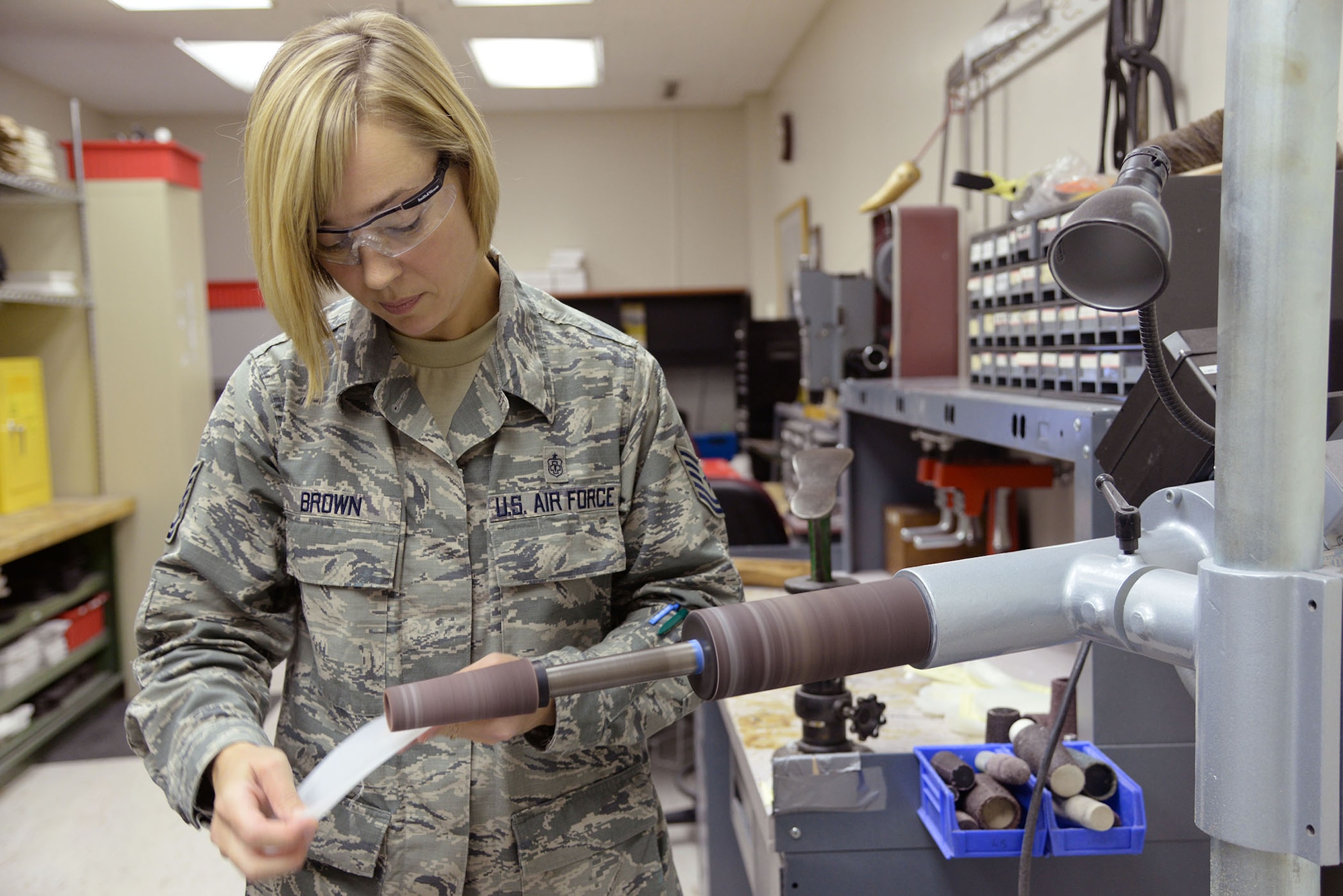 Tech. Sgt. AnnaMaria Brown, 59th Medical Operations Group orthotic course supervisor, prepares a custom orthotic piece at the Wilford Hall Ambulatory Surgical Center on Joint Base San Antonio-Lackland, Texas, Sept. 4, 2014. The 59th MDW Orthotic Lab creates custom braces for all military members, as well as retirees and dependents, using different materials, depending on the amount of support and stability required. (U.S. Air Force photo/Staff Sgt. Christopher Carwile)